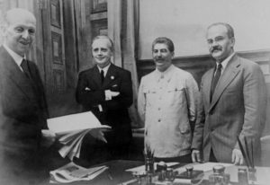 From left: Friedrich Gaus from Germany, Joachim von Ribbentrop, German Foreign Minister, Joseph Stalin, Soviet head of state and his Foreign Minister Vyacheslav Molotov pose 23 August 1939 in Kremlin in Moscow after signing the Soviet-German Non-Aggression Pact, making the outbreak of a European war virtually inevitable. After the ceremony, Stalin proposed a toast: "I know how much the German people love their Fuehrer" (Hitler), he said. "I should therefore like to drink to his health". AFP PHOTO